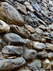 Close-up to of an old stone wall with the spider net