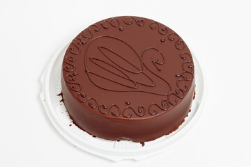 Cake in chocolate glaze on white background. Chocolate cake.