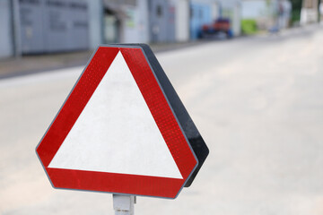 white and red triangle traffic sign