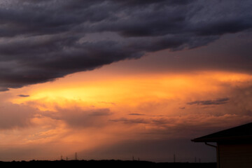 Fototapeta na wymiar A dramatic sky at sunset after a storm