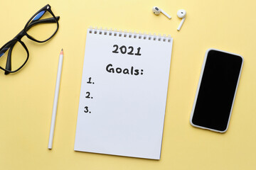 The concept of setting goals for the year 2021 in the diary.
