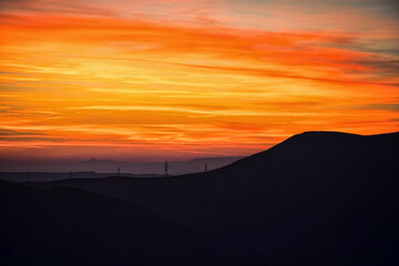 Colorful sunset over the mountain hills. Beautiful landscape in Azerbaijan nature.