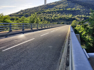 A summer panorama of a great white cable bridge. Bridge crossing the valley.  Natural panoramic...