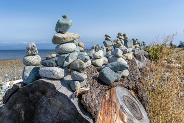 Inuksuk sculpture on a beach environmental art