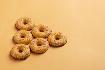 Round cookies on yellow background. Side view