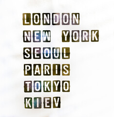 Famous cities names (London, New York, Seoul, Paris, Tokyo and Kiev) on airport timetable board style. Travel destination plan for vacation concept, retro typography style on a black frame. 