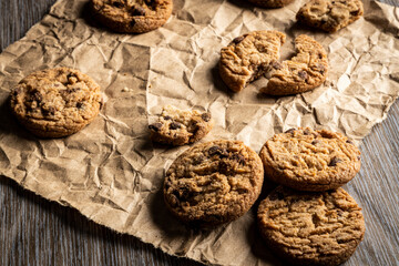 freshly baked Chocolate chip cookies on a wooden table with place for text. Copy space.