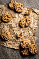 freshly baked Chocolate chip cookies on a wooden table with place for text. Copy space.