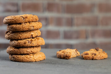 freshly baked Chocolate chip cookies on a stone table with place for text. Copy space.