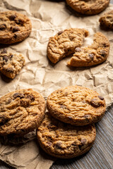 freshly baked Chocolate chip cookies on a wooden table with place for text. Copy space.