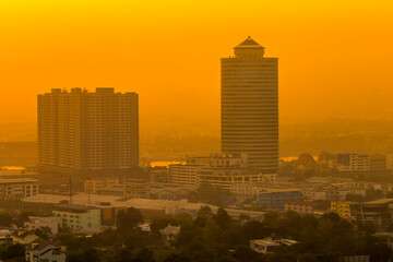 The high angle background of the city view with the secret light of the evening, blurring of night lights, showing the distribution of condominiums, dense homes in the capital community
