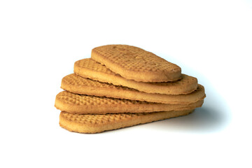 Stack of textured brown cookies isolated on white background
