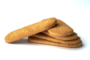 Stack of textured brown cookies isolated on white background