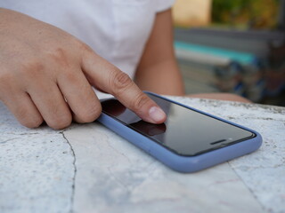 closeup of hand woman using smartphone shopping online.