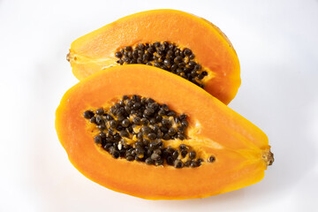 Papaya cut in half and isolated on white background