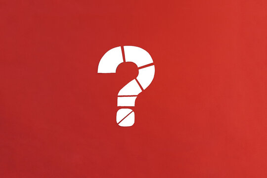A white question mark consisting of parts on a red background. Clarification of the situation.