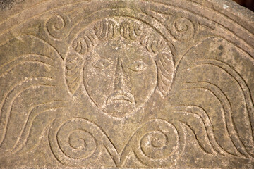 Detail of Headstone at Sawyer Hill Buying Ground, Newburyport MA. Built in 1695. Beautifully carved gravestone from the 1700's close up. Historic site.