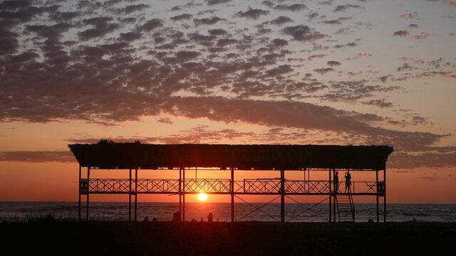 Beautiful viewpoint on the beach of Salinas - Ecuador at sunset in summer - red sunset