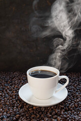 Fototapeta premium Hot coffee cup and smoke with steam on the wooden table .hot food