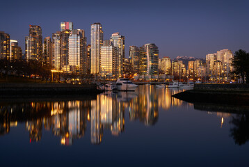 Obraz na płótnie Canvas Sunset Reflection False Creek Vancouver. Yaletown towers across False Creek at sunset in Vancouver. British Columbia, Canada.