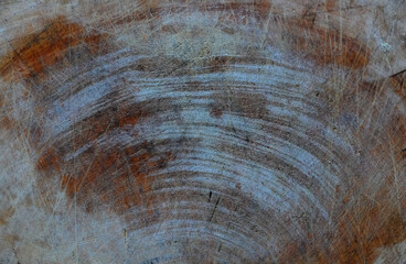 Dark scratched wooden cutting board. Wood texture