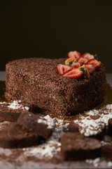  Delicious Chocolate Cake in the shape of a heart decorated with strawberries and surrounded by...