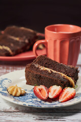 Fototapeta na wymiar Delicious portion of Chocolate Cake with Strawberries