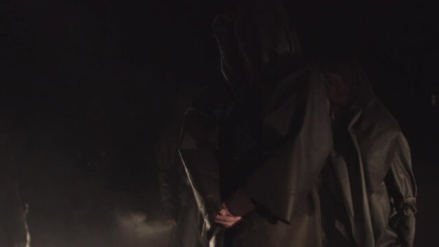 Sect. people in black coats. rite, cult