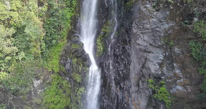 Scenery Of Cascades From Mainapi Waterfall In Cotigao Wildlife Sanctuary, Netravali, South Goa, India. - Aerial Pullback Shot