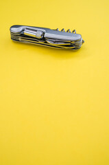 Vertical isolated shot of the multifunctional pocket knives