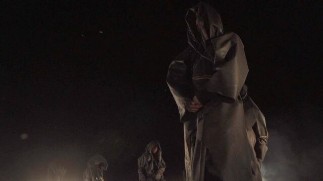 Sect. people in black coats. rite, cult