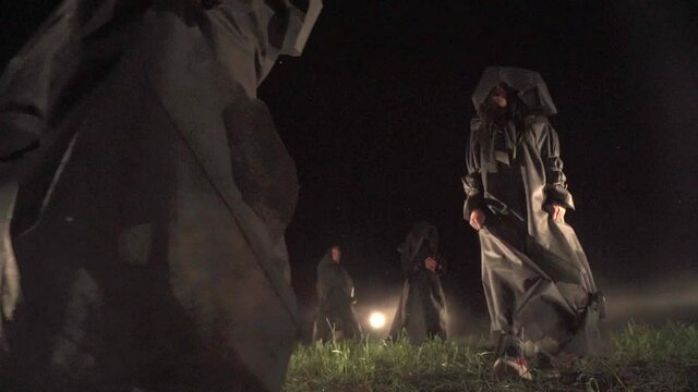 Sect. people in black coats. rite, cult