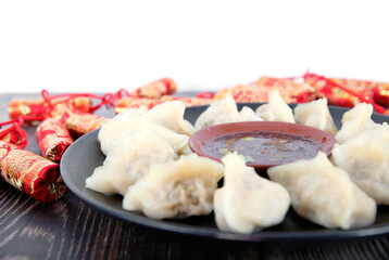 A plate of dumplings and firecrackers