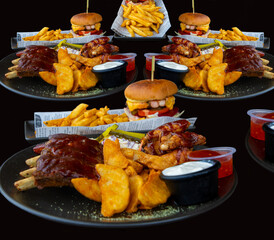 Hamburgers with chips and ribs and dipping sauce