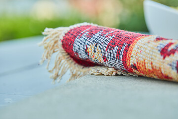 Small carved rug on white background