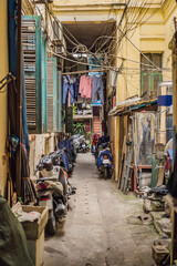 Street scene from a narrow alley in the old quarter in Hanoi. Streets and guilds of the old quarter are a major tourist attraction © galitskaya