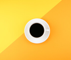 cup of coffee on yellow and orange background