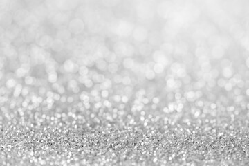blurred sparkling white color glitter light as abstract festive background for website banner and card decoration design