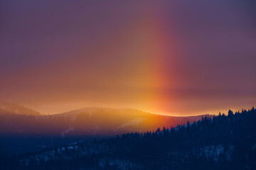 Sunset and Winter Rainbow High in Rolling Big Hole Mountains Idaho
