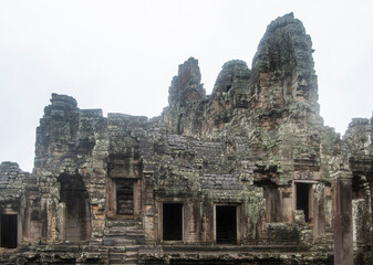 Fototapeta na wymiar Bayon the central temple of Angkor Thom, late 12th century. It rains in the rainy season. (Cambodia, 04.10. 2019)