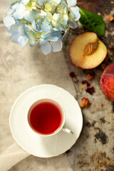 Obraz na płótnie Canvas Cup of peach flavor tea