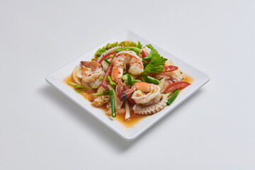 Spicy seafood salad with steamed shrimp and squid. Popular Thai dishes