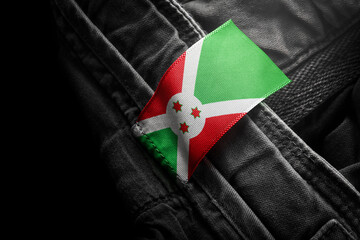 Tag on dark clothing in the form of the flag of the Burundi