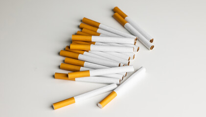 Many cigarettes stacked together. Drugs are harmful to the respiratory system.