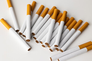 Many cigarettes stacked together. Drugs are harmful to the respiratory system.