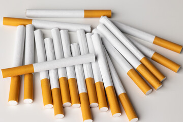 Many cigarettes stacked together. Drugs are harmful to the respiratory system.