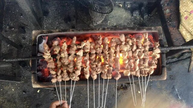 Satay Klatak making process. Sate klathak is a unique goat satay or mutton satay dish, originally from Yogyakarta, Indonesia. Indonesian Culinary food