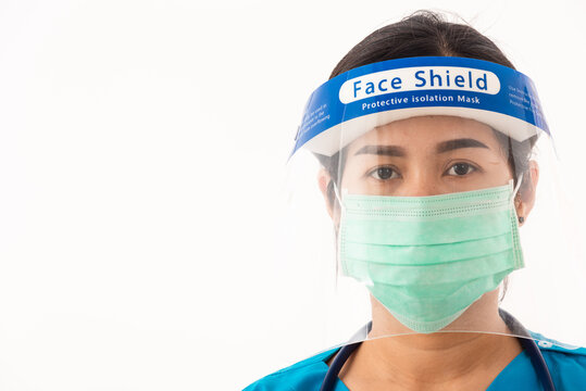 Medical Staff Nurse Wearing A Face Mask Protective And Plastic Face Shield