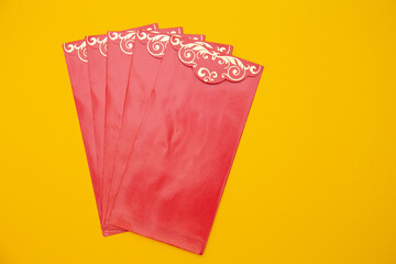 Pack of red envelope isolated on yellow background. Lunar new year, chinese new year , Tet holiday concept 