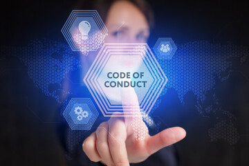 Business, Technology, Internet and network concept. Young businessman working on a virtual screen of the future and sees the inscription: Code of conduct